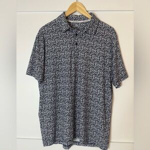 Rorie Whelan Classic Navy Floral Polo Shirt size large in great condition
